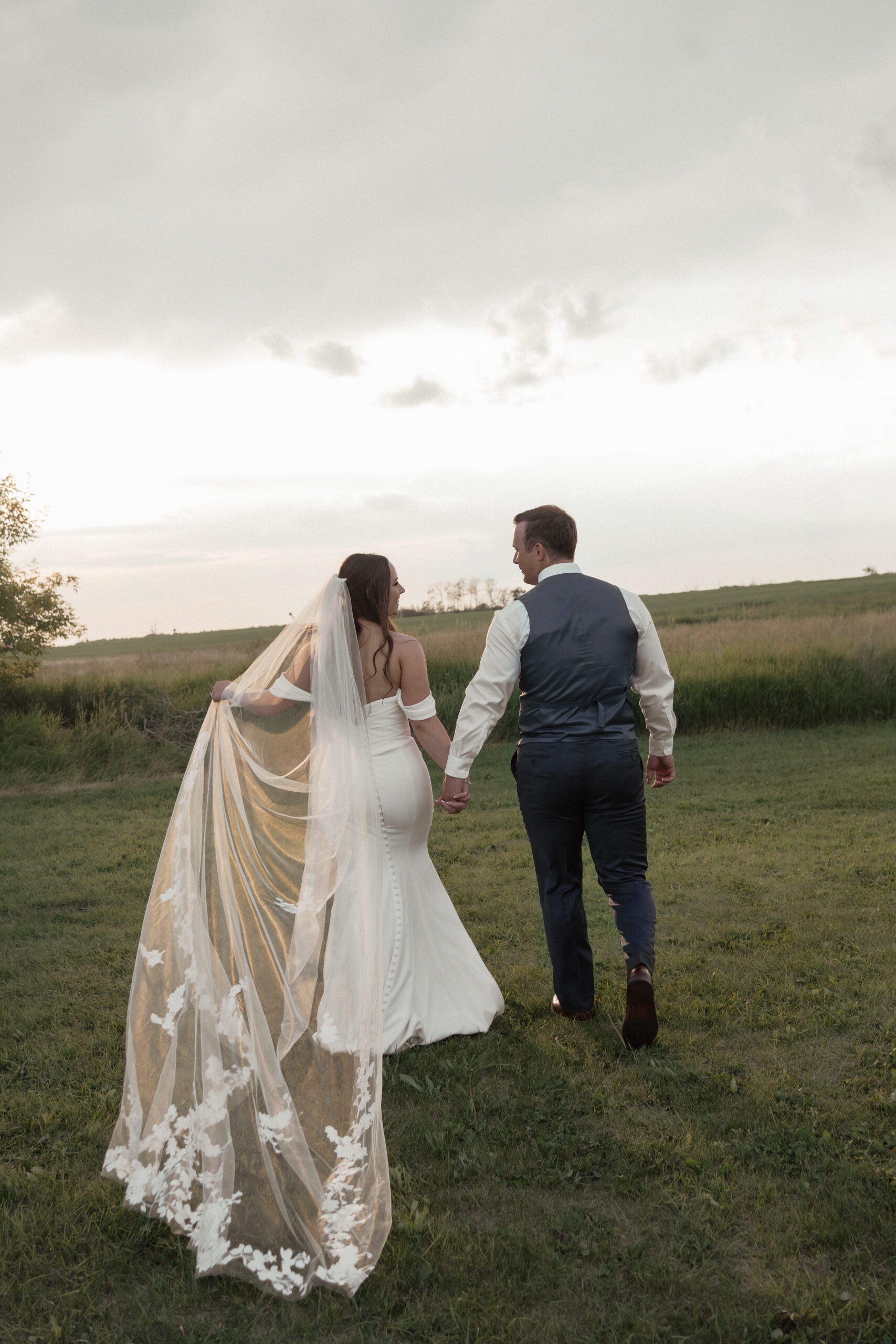 Bride and Groom adventuring at sunset during their intimate backyard wedding